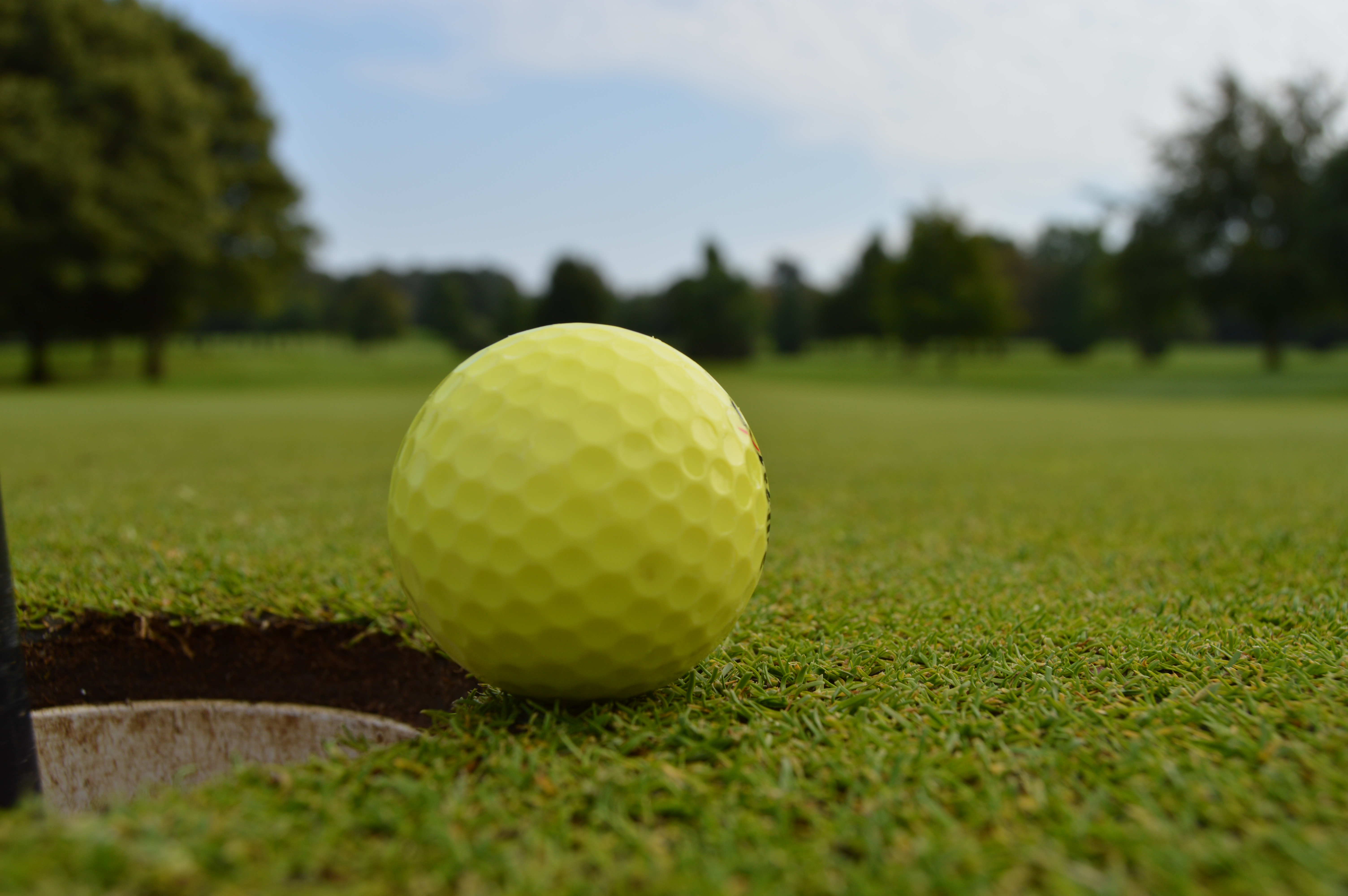 Golf ball near the hole