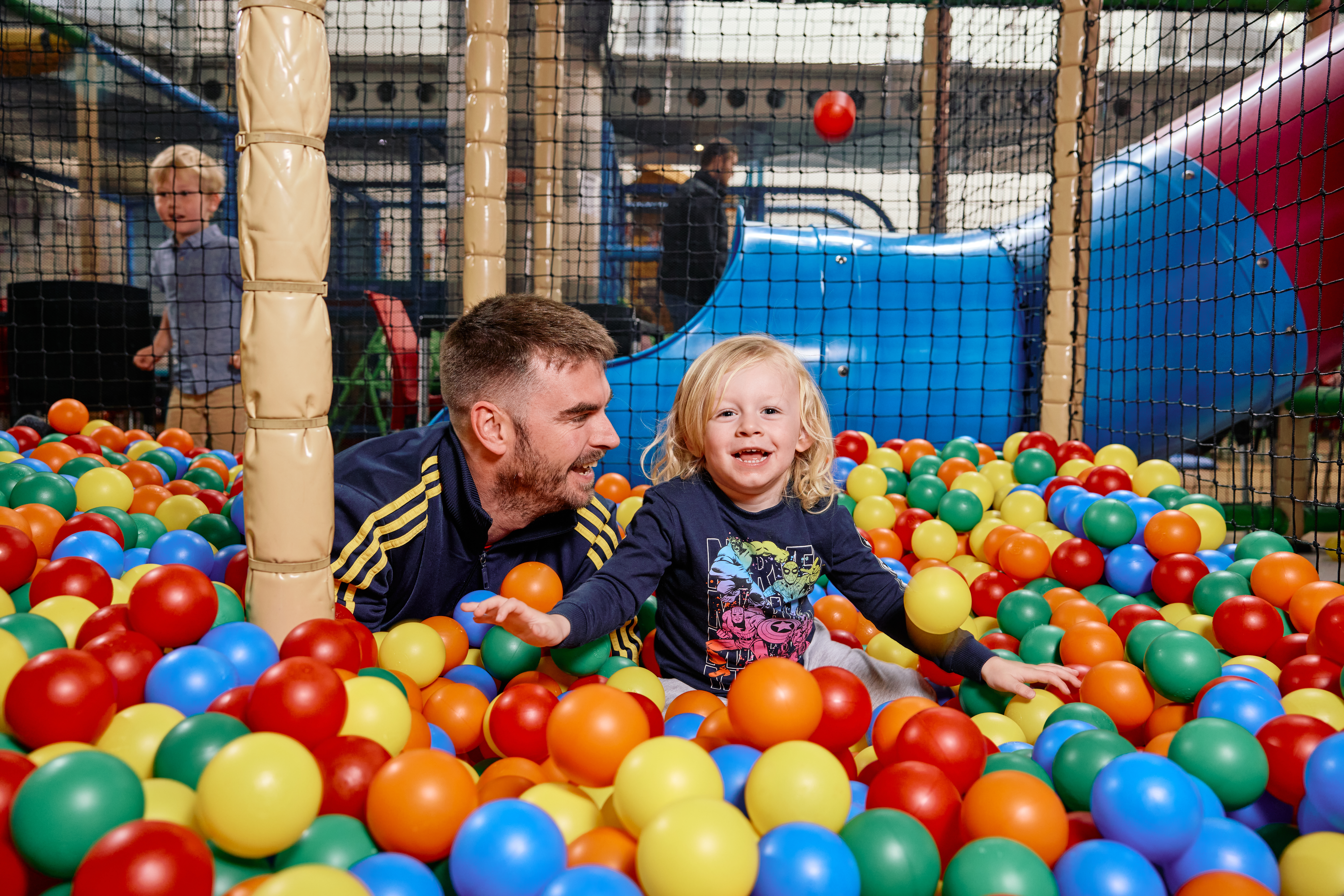 Fmily On A Playground Rubber Balls